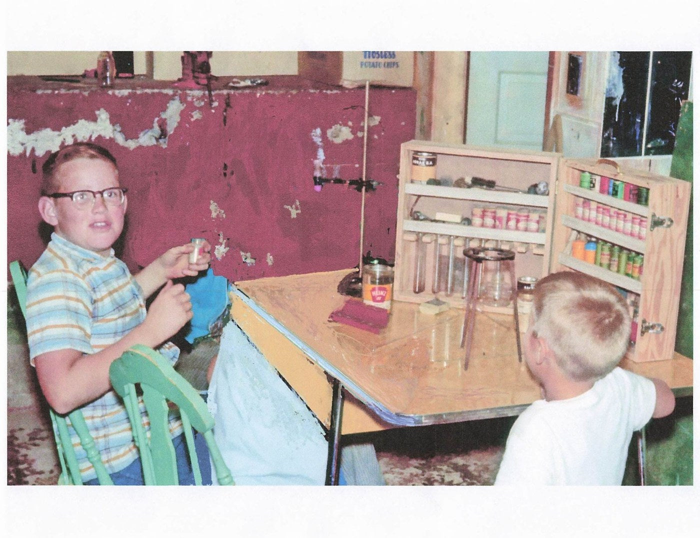 AJ as a boy, at his chemistry set.